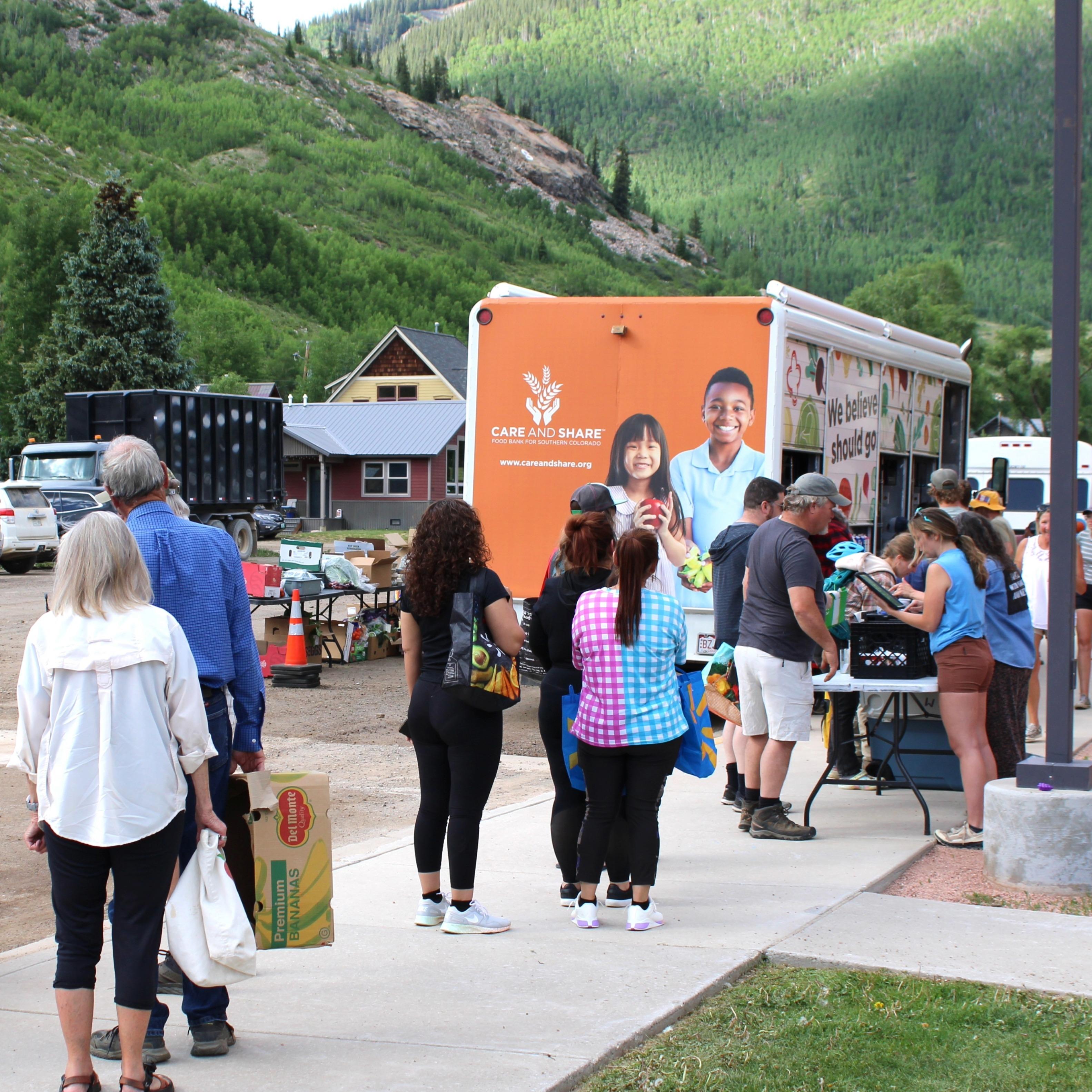 people standing in line for the Mobile Market